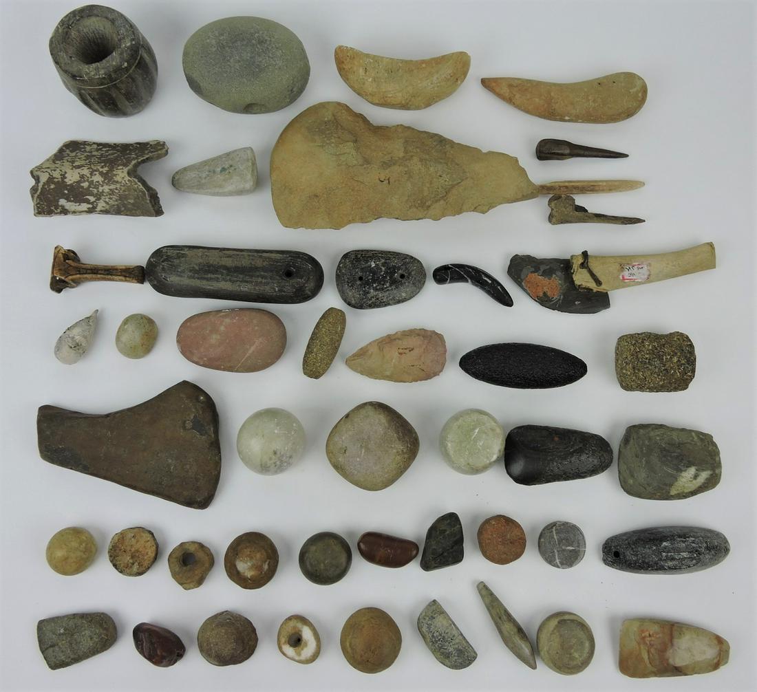 American Indian lot of 47 assorted relics: including carved bone, game stones, discoidals, adz, awes, boatstones, net weights and tools