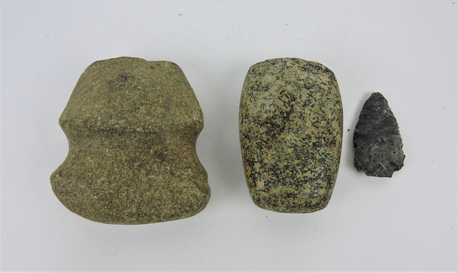 Lot of 3 Indian relics: axe, celt, and: arrowhead