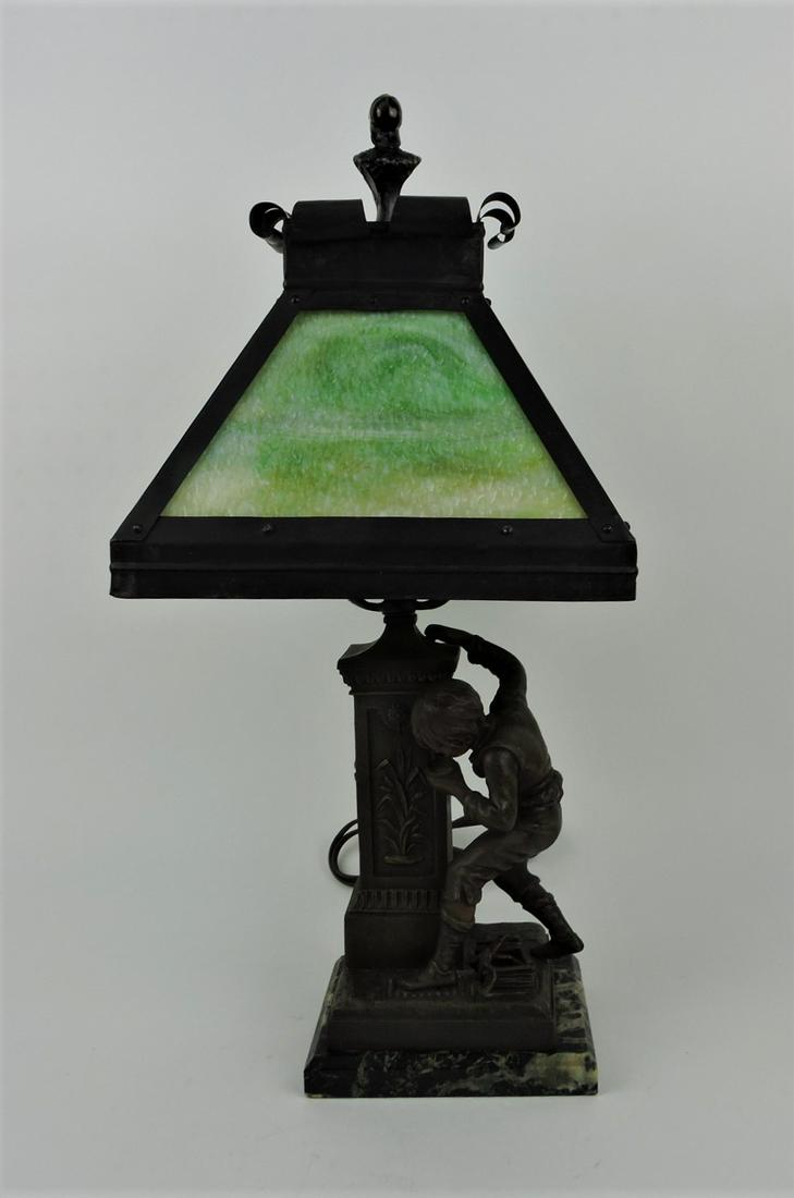 Bronze patinated figural lamp of boy: at fountain, foundry mark Juan Terville with panel glass shade, 21"h, 10"w