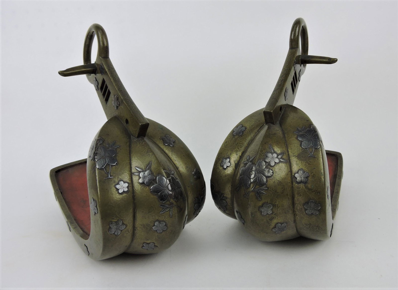 Rare pair of Japanese Edo Abumi: Samurai bronze with silver inlay stirrups, red lacquered interior, signed Yoshishige saku, 17th century