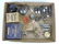 Box of old spark plugs, valves, and