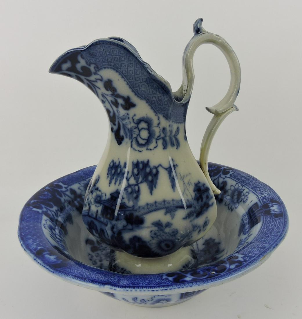 Flow Blue Canton pitcher and bowl,: base rim nick and rim chip under glaze to bowl, pitcher with handle repairs, 13"h