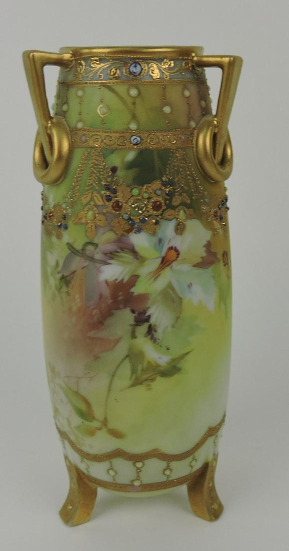 Nippon triple handled vase with jewels,: heavy gold and floral motif, 8 3/4", minor nick to corner of one foot.