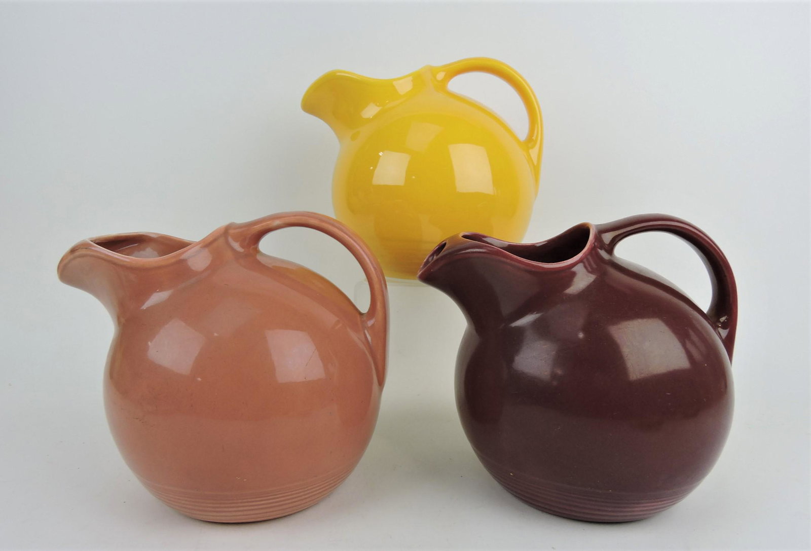 Fiesta Harlequin lot of 3 service water: jugs; maroon, rose, yellow
