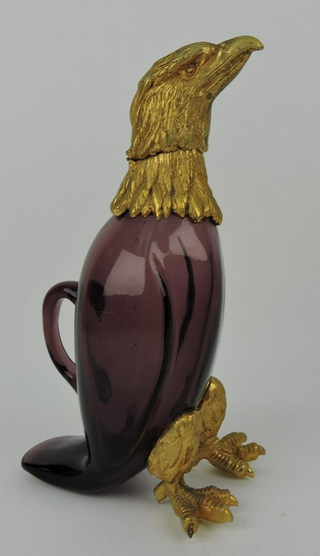 Amethyst claret jug in the form of an: eagle with brass ormolu feet and head, 11"