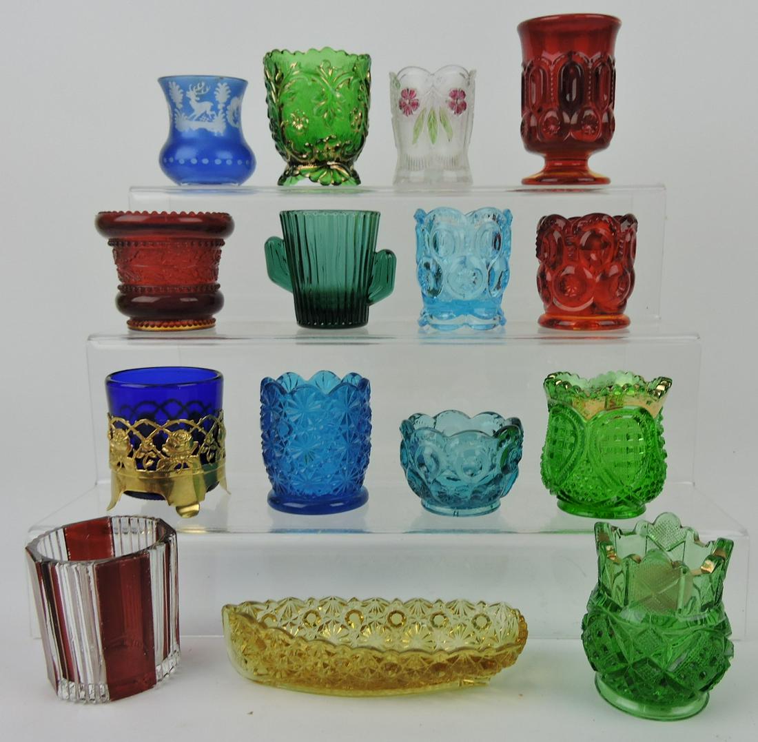 Toothpick holder lot of 15: amber daisy and: button boat, ruby stained pleat & panel, green sunbeam, green Heisey fancy loop, blue daisy & button, Libbey cactus, Bohemian stag, emerald green Flora, Double Dahlia, and others