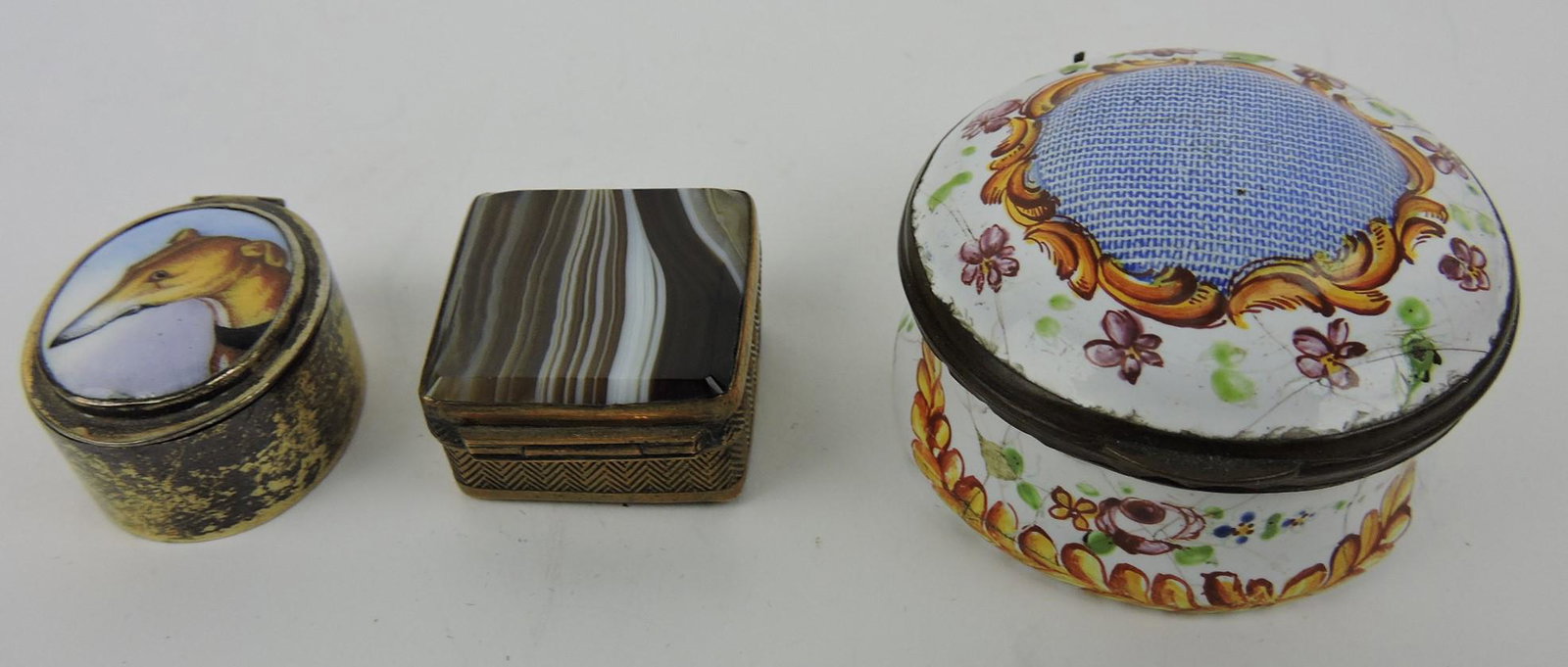 Silver oval pill box with porcelain: greyhound painted top; banded agate pill box; and early 18th century enameled pill box