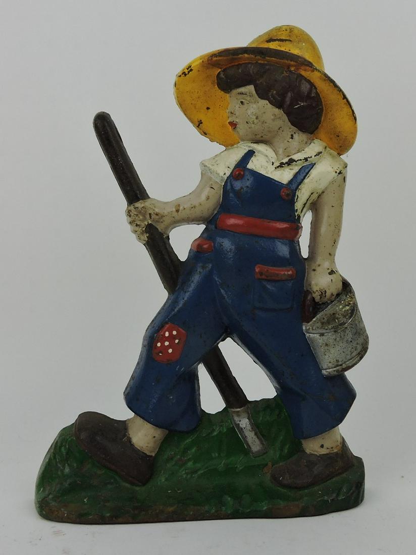 Vintage cast iron doorstop of lady (1 of 1)