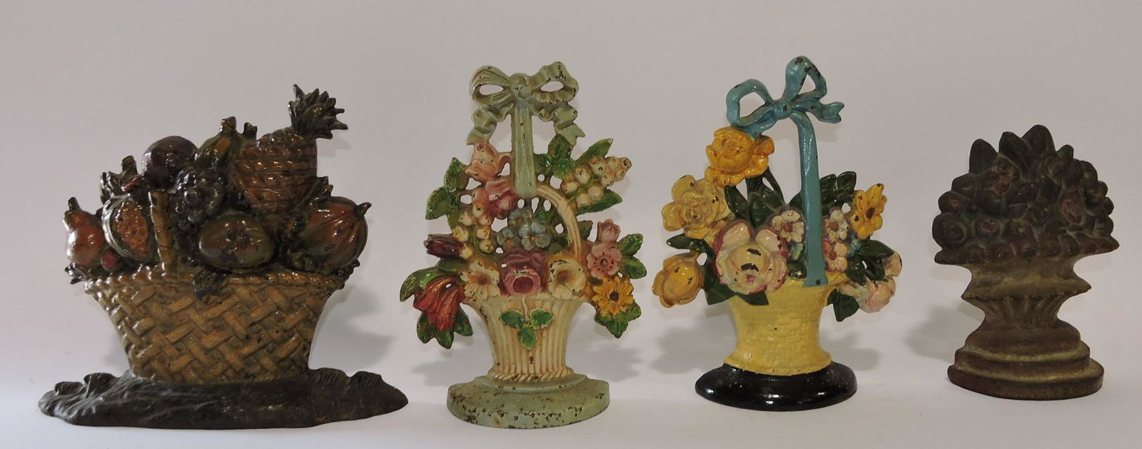 Cast iron lot of 4 door stops: 3 floral, (1 of 1)