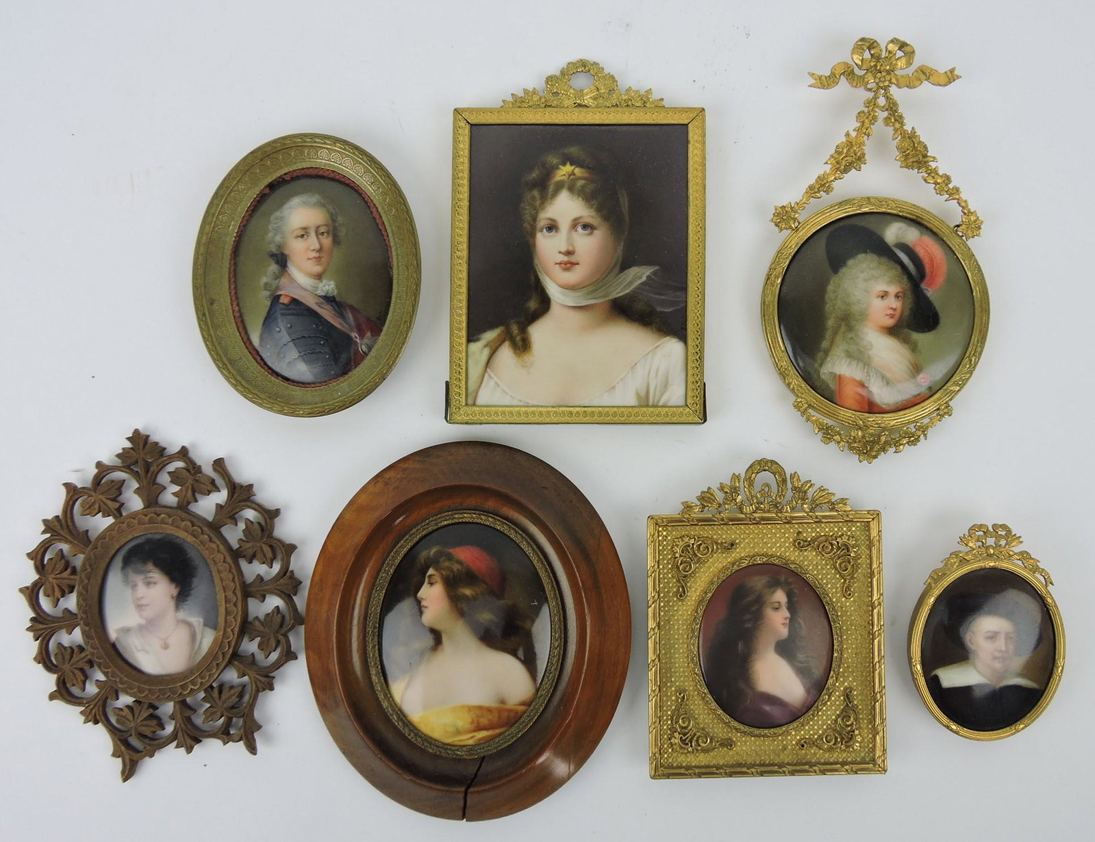 Lot of 7 porcelain miniature portraits:: oval gentleman signed Wagner 3 1/4"x2 1/2"; KPM of lady 4 3/4"x3 1/4"; round portrait of lady 3" Hutschenreuther; oval of young lady 2 1/4"x1 3/4"; oval of lady in yellow dress and red hat 3 1/2"x2 3/