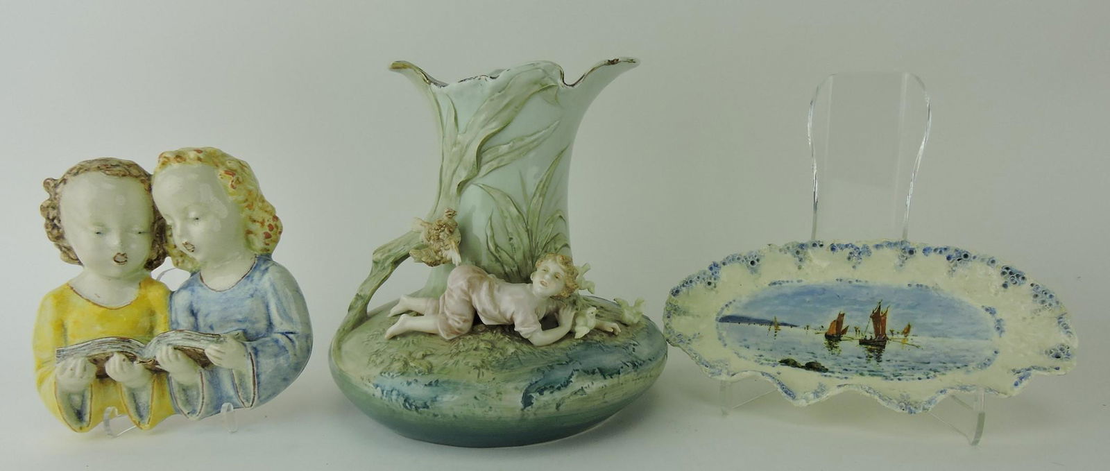 Non majolica plaque with two girls: singing, porcelain vase with child and chicks, and scenic tray, various condition
