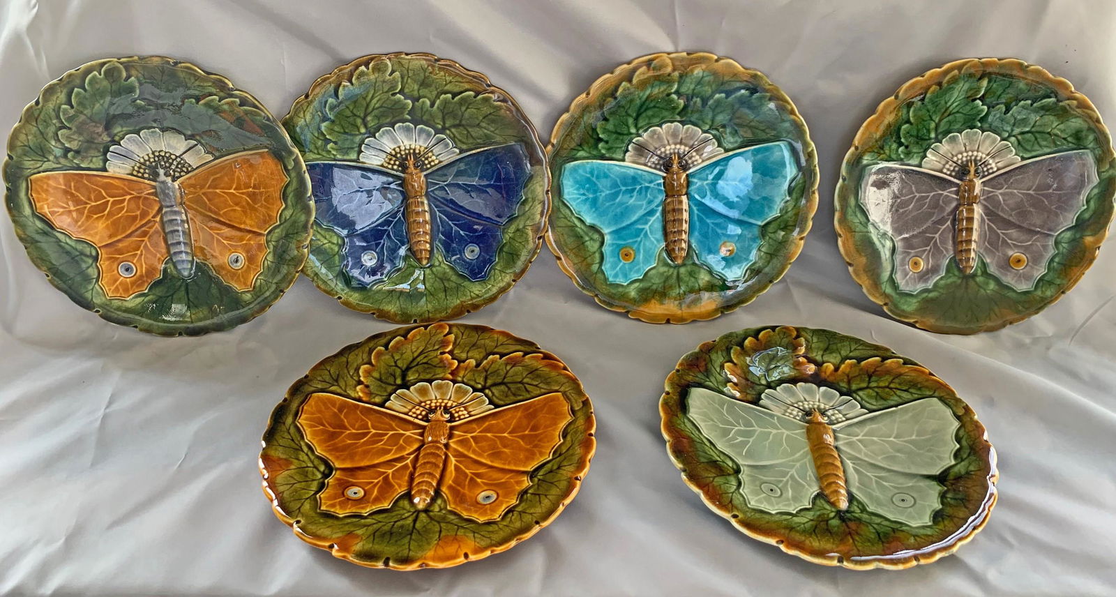 RARE majolica set of 6 Schutz: butterfly dessert plates, c. 1890, each designed as a large butterfly on bed of green leaves and sunflower, 7"