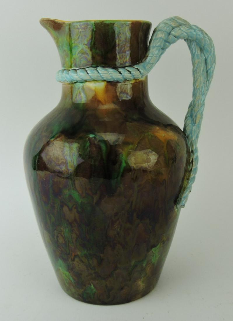 George Jones majolica mottled: pitcher with turquoise rope handle, spout chip, 10"