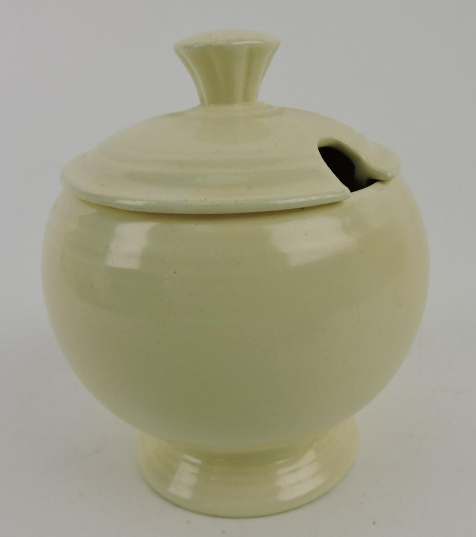 Fiesta marmalade, ivory, nick to underside rim of lid (1 of 1)