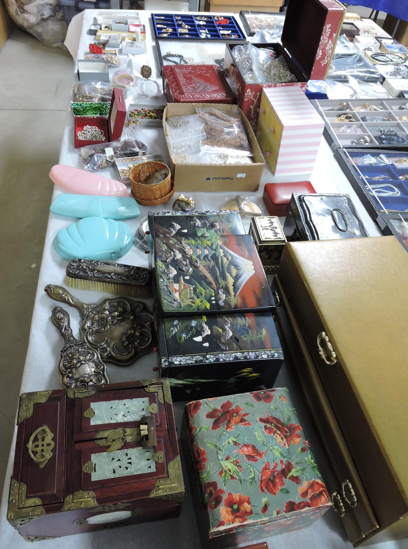 8' table full of jewelry and jewelry boxes,: some signed, brooches, necklaces, bracelets, earrings, and more