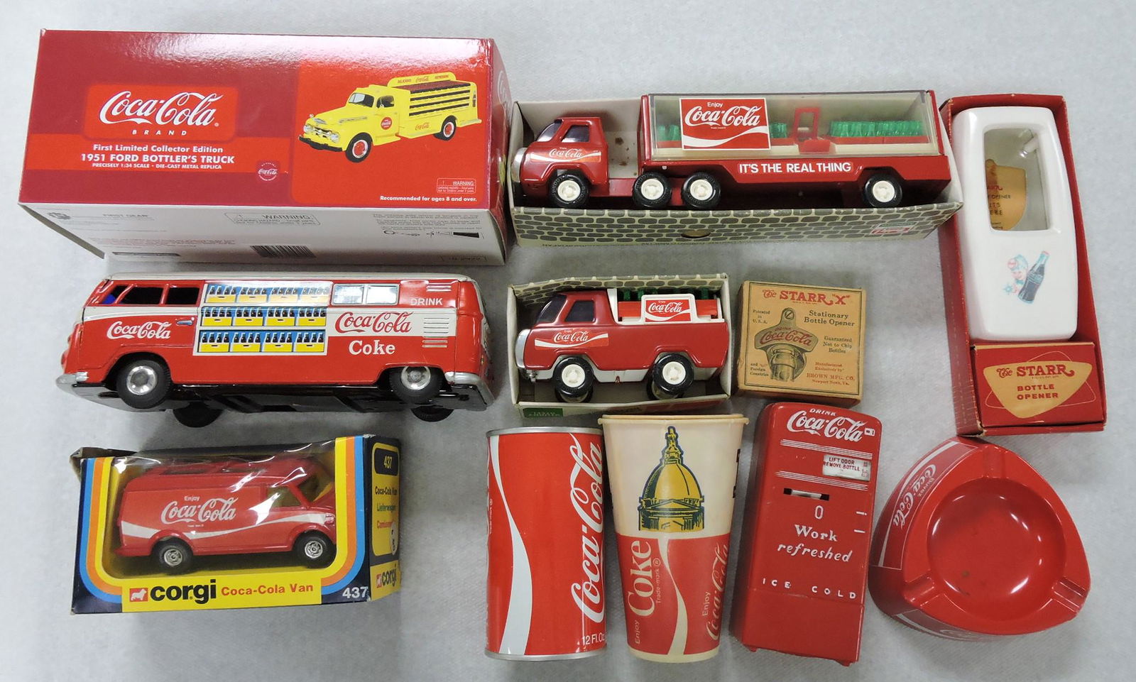 Coca Cola lot of toy trucks, bottle: openers, can bank, ashtray, cooler bank