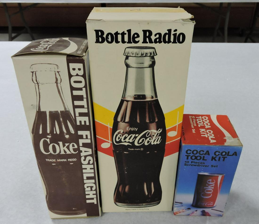 Coca Cola flashlight, bottle radio,: and can tool kit