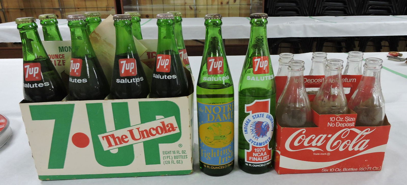 7UP lot of 9 Notre Dame bottles 1973,: 1979 Indiana State, and 6 pack Coca Cola bottles