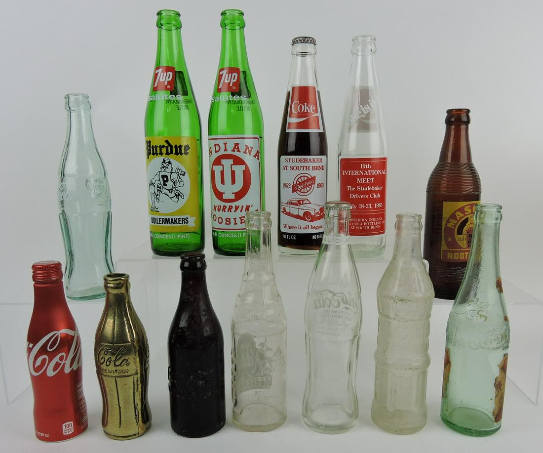 Lot of 13 assorted soda bottles -: Coca Cola brown Huntsville AL, brass, aluminum, and other