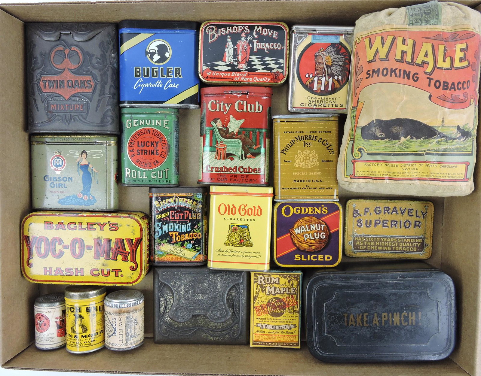 Lot of 20 tobacco tins and related:: Twin Oaks, Bugler, Bishop's Move, 111, Whale Smoking Tobacco, Gibson Girl, Lucky Strike, City Club, Philip Morris, Yoc-O-May, Buckingham, Old Gold, Ogden's Walnut Plug, B.F.Gravely, Scotch Snuff, Trip