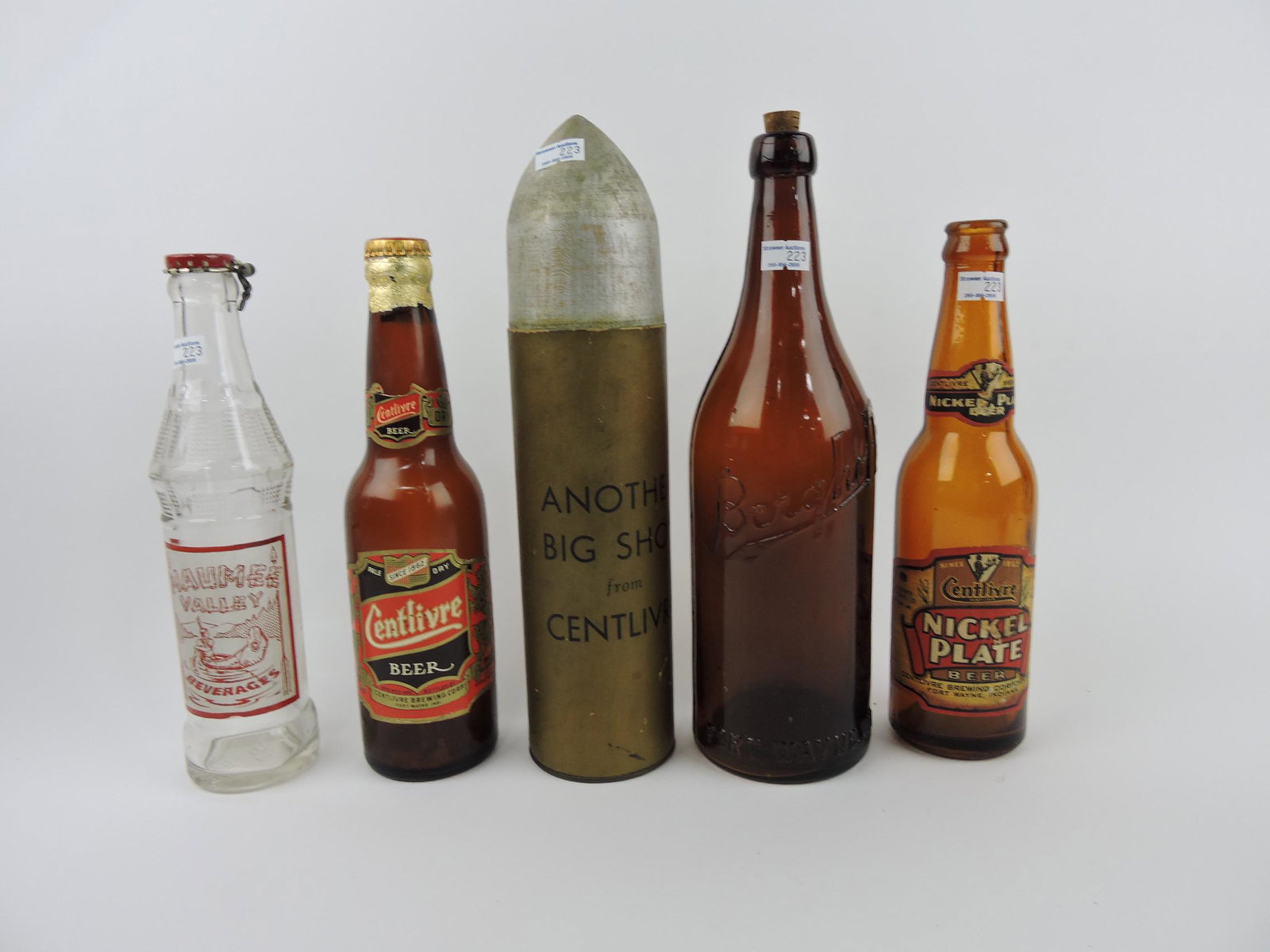 Fort Wayne Indiana advertising: bottles: Maumee Valley Beverages, Centlivre beer bottle with wood and cardboard bullet shaped bottle holder "Another Big Shot from Centlivre", Berghoff beer bottle, Centlivre Nickel Plate beer bottle