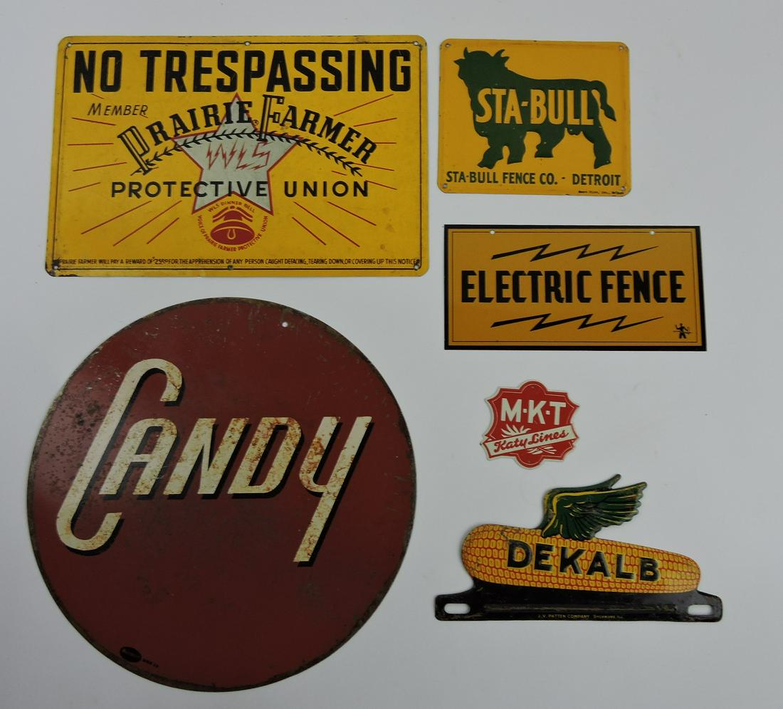 Lot of 7 advertising signs: Prairie Farmer,: Sta-Bull Fence, Electric Fence, M-K-T Katy Lines, Candy, Dekalb Corn license plate topper, and Old American Asphalt Shingles
