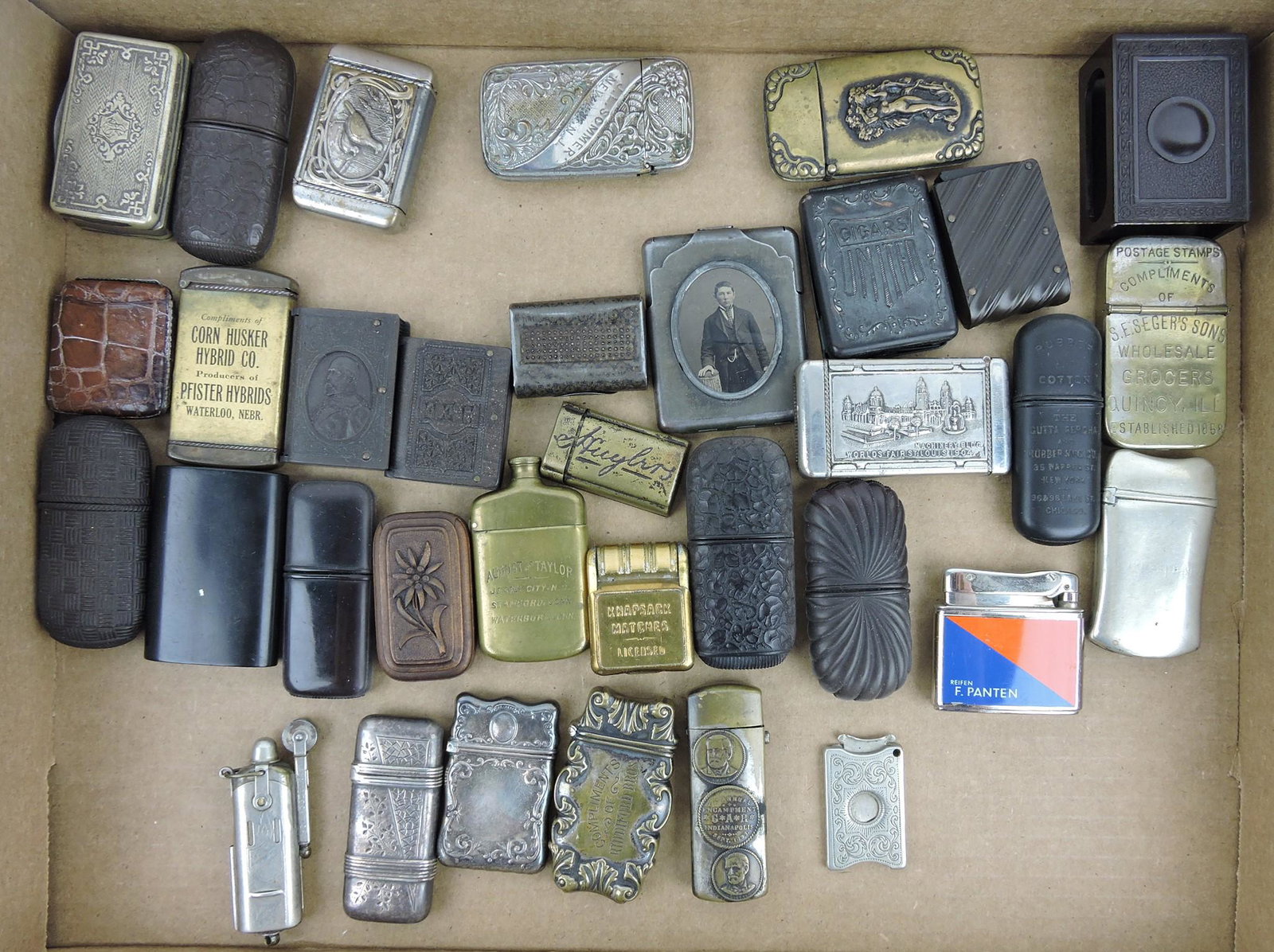 Lot of 34 pocket match safes (some: sterling), cigar cutter, lighters, and more