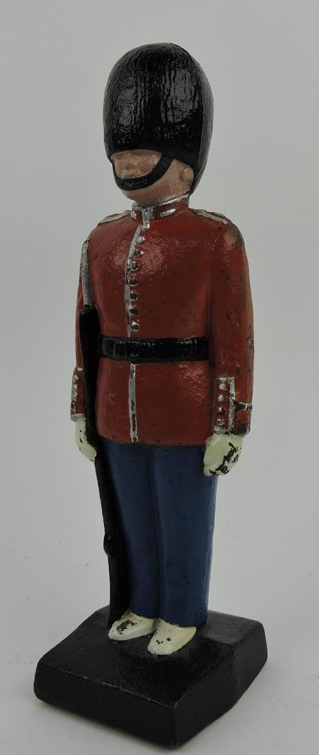 Cast iron door stop of a British Royal: Guard, 9 1/2"