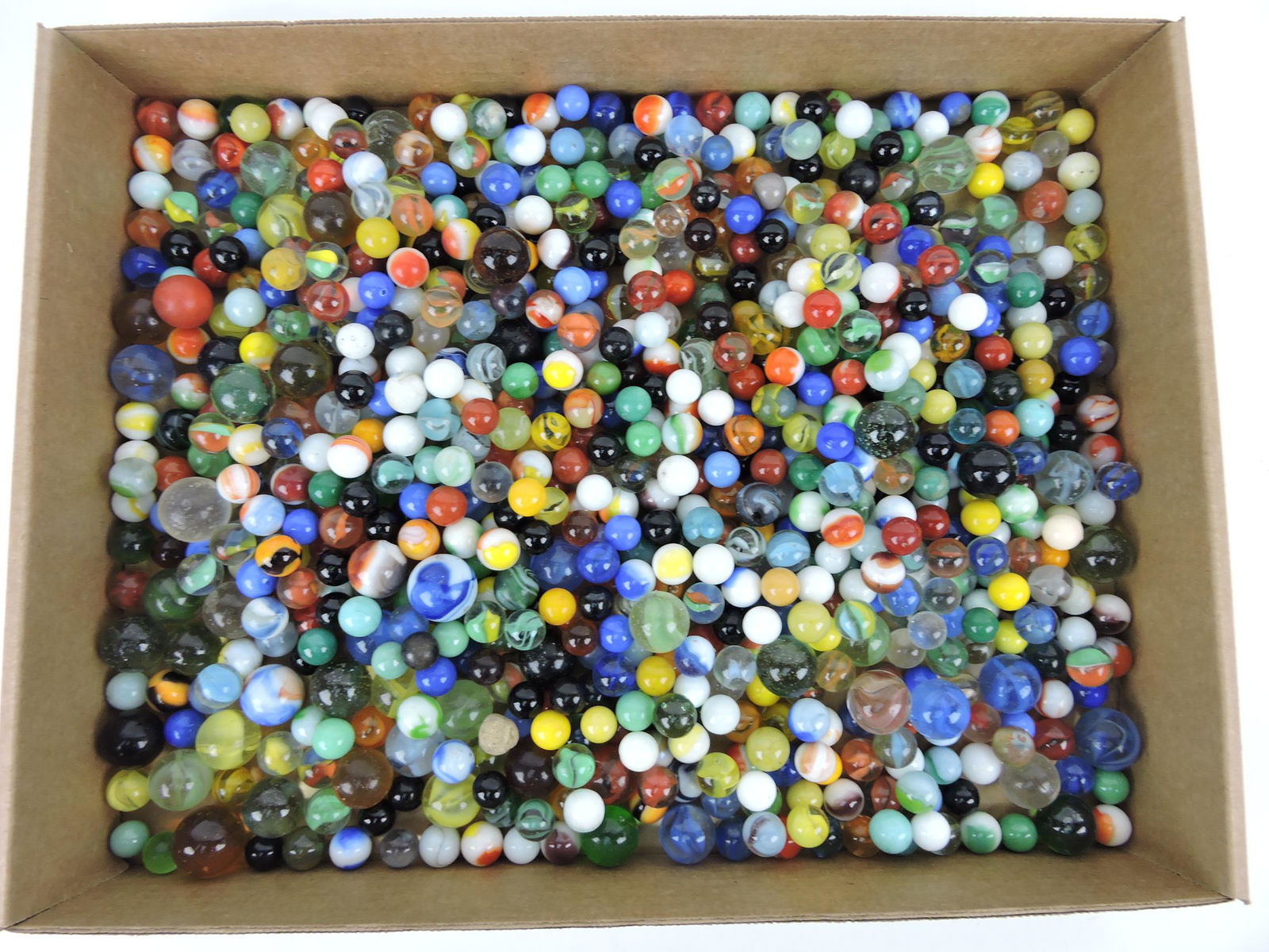 Box of old marbles, unsorted: .