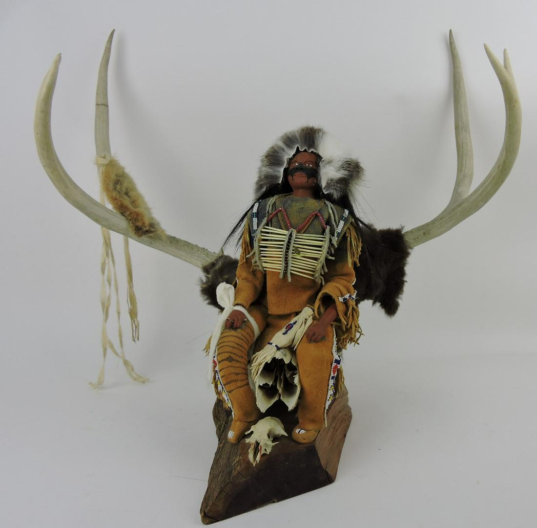 "Looks at the Sun" American Indian: sculpture with deer antlers, 1993, Pam Hutson, 20"h, 21"w