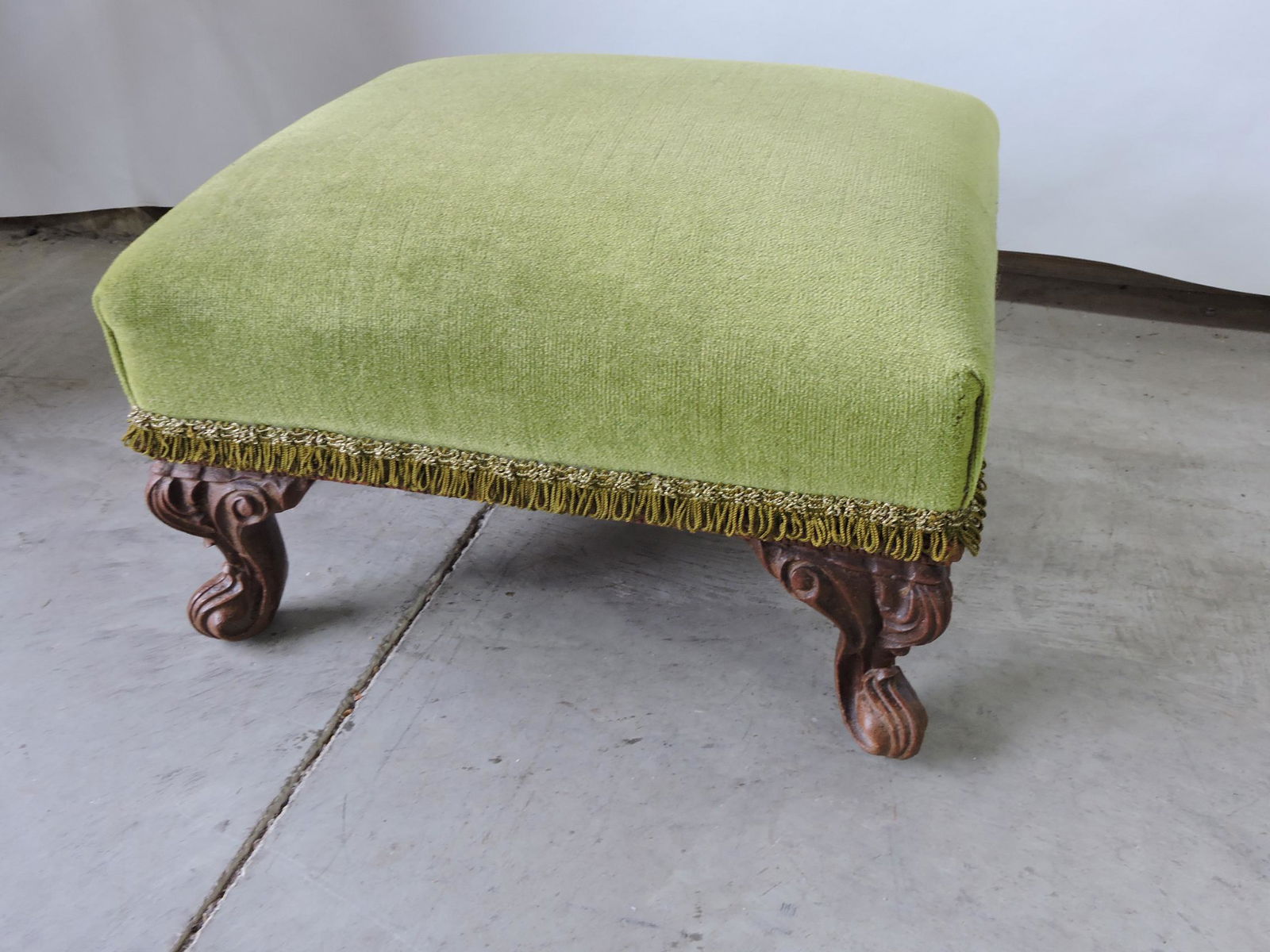 Upholstered footstool with wooden legs, (1 of 1)