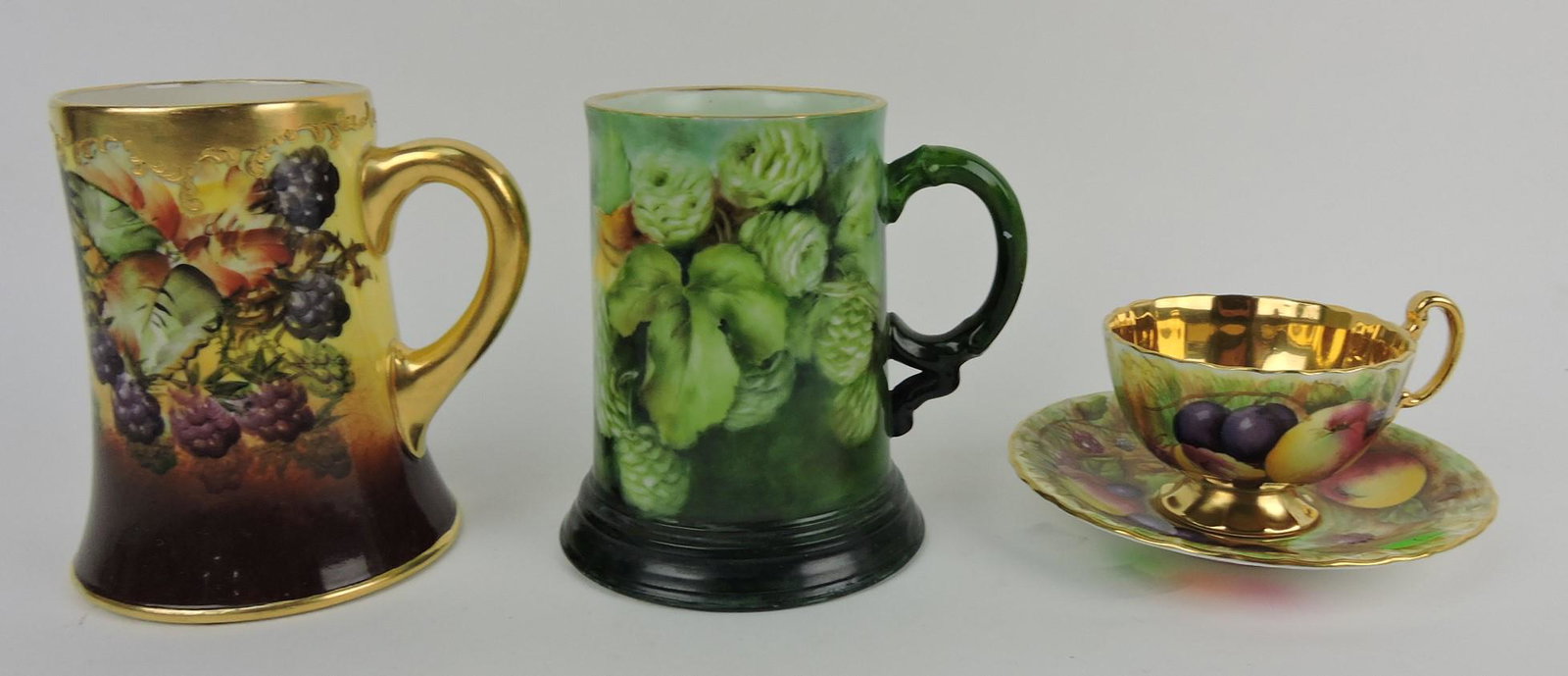 Belleek blackberry tankard mug, Limoges: tankard mug, and Aynsley Bone China cup & saucer with fruit motif, artist signed N. Brunt