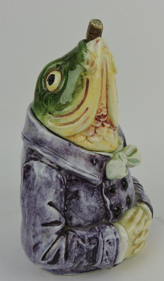 Majolica figural fish with purple smoking