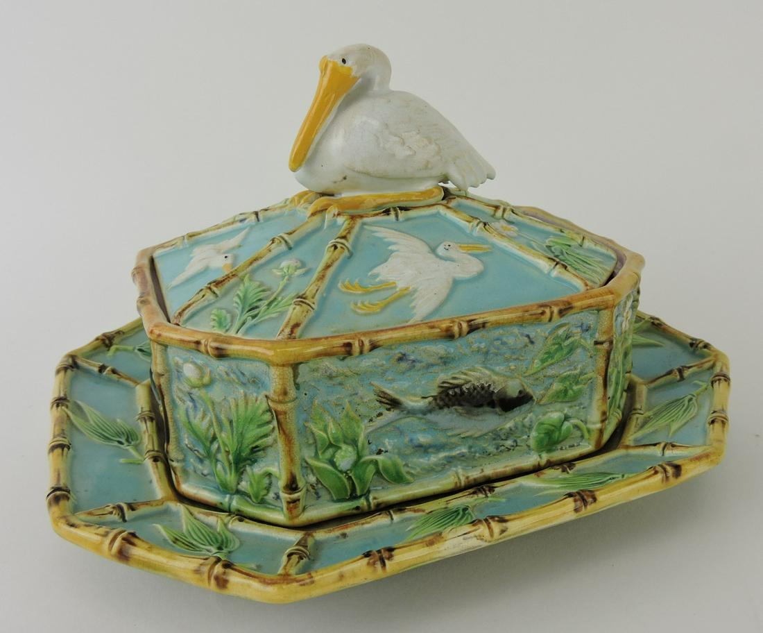 George Jones majolica sardine box: and stand with pelican finial, box with fish and sealife in relief trimmed in bamboo, stand decorated with bamboo and leaves, 8 1/2"l, 5 1/2"h; Ann & Robert Fromer Collection