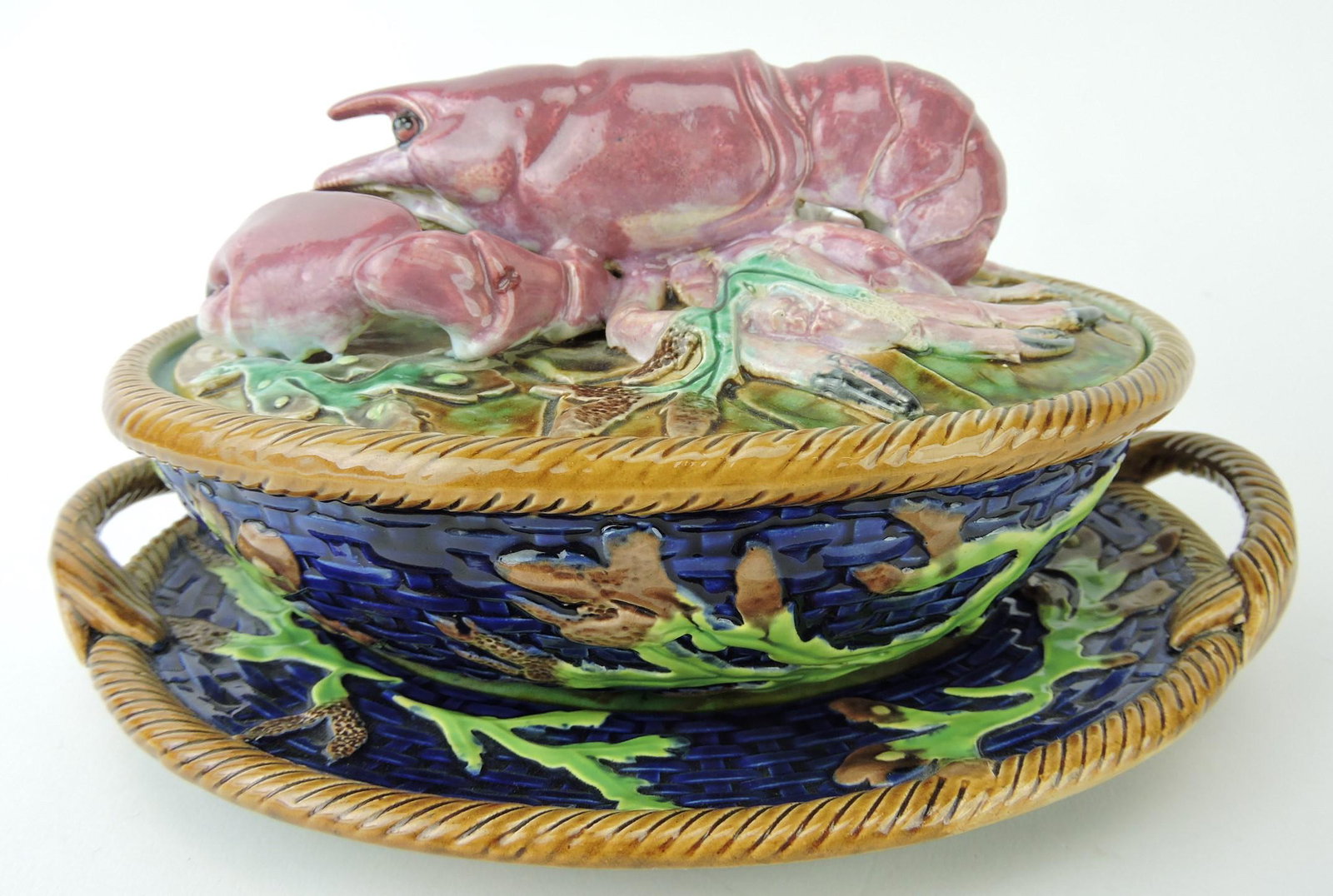 George Jones rare majolica pate box: on stand modeled as a basket with coral, the base with twin rope handles and the cover modeled as a large lobster on a bed of seaweed, extremely rare cobalt ground, 9 1/4"w; Ann & Robert Fromer Collec