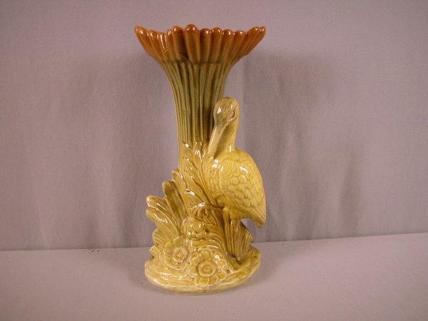 Vance Faience figural vase in the form of a stork: Vance Faience figural vase in the form of a stork in bullrushes, minor nick on base, 13 1/2", made in Tiltonstville, Ohio