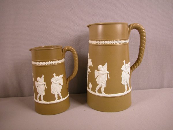 Pair of brown parian jugs with Classical figures, : Pair of brown parian jugs with Classical figures, 6" & 8"