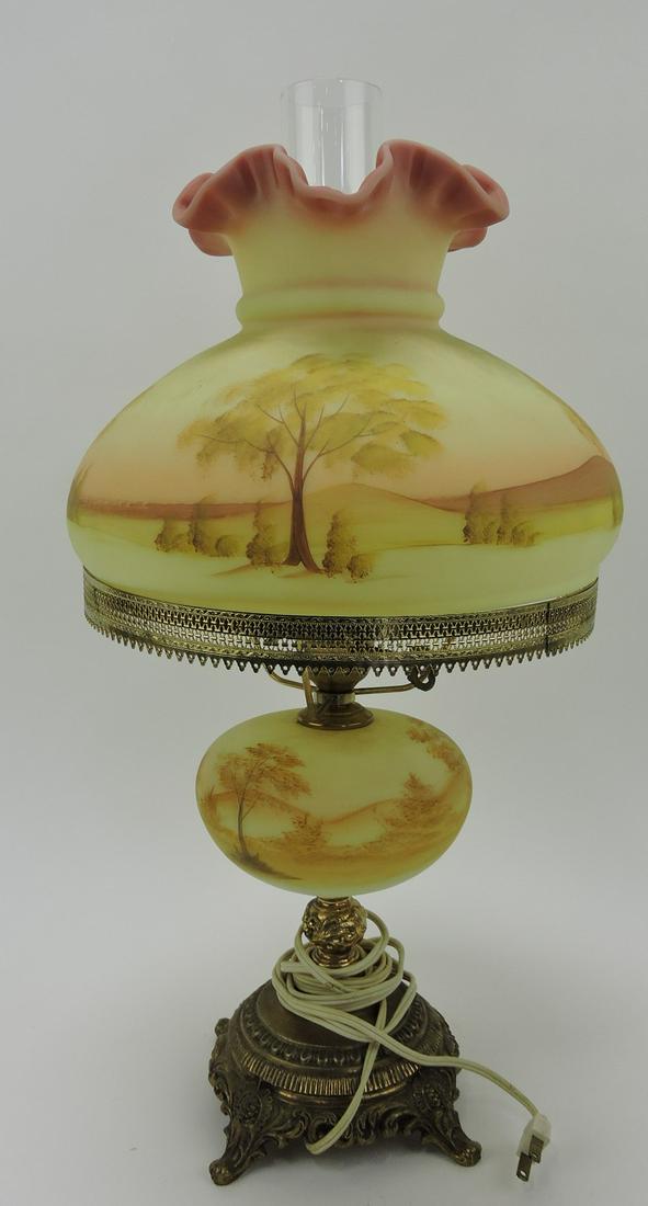 Fenton burmese banquet lamp with painted: landscape motif