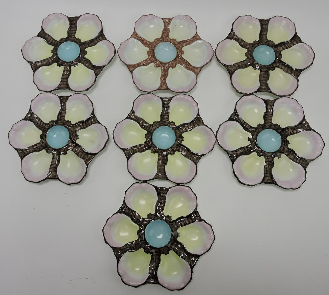 Porcelain set of 7 - 9" six well oyster: plates