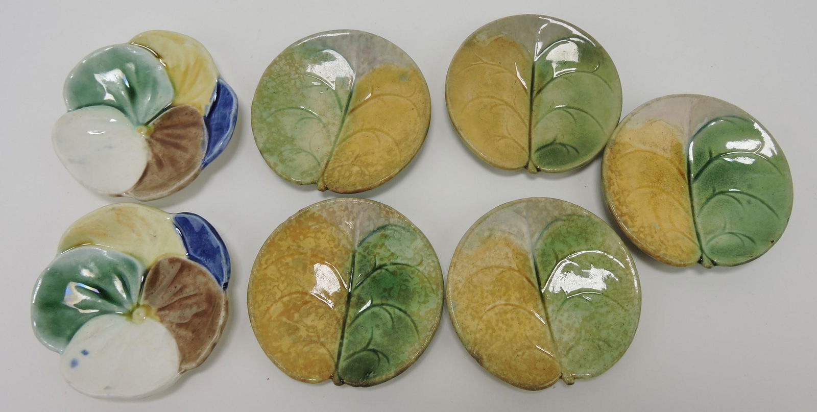 Etruscan majolica lot of 7 butter pats: .