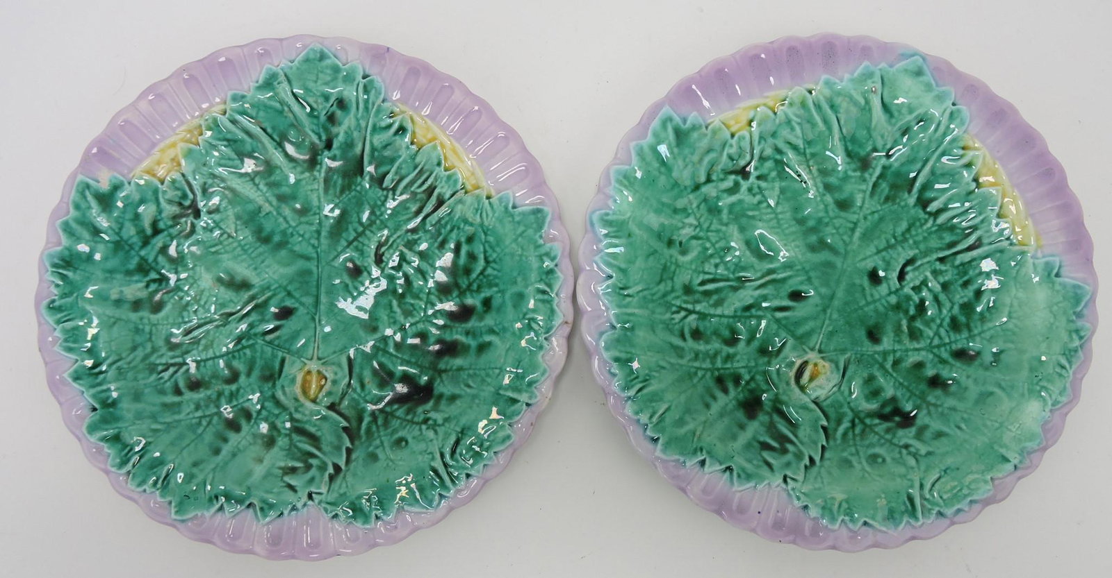 Majolica pair of 8 1/2" leaf on wicker plates: .