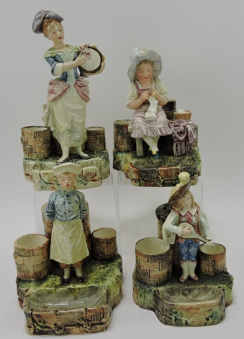 Majolica lot of 4 figural match strikers: .