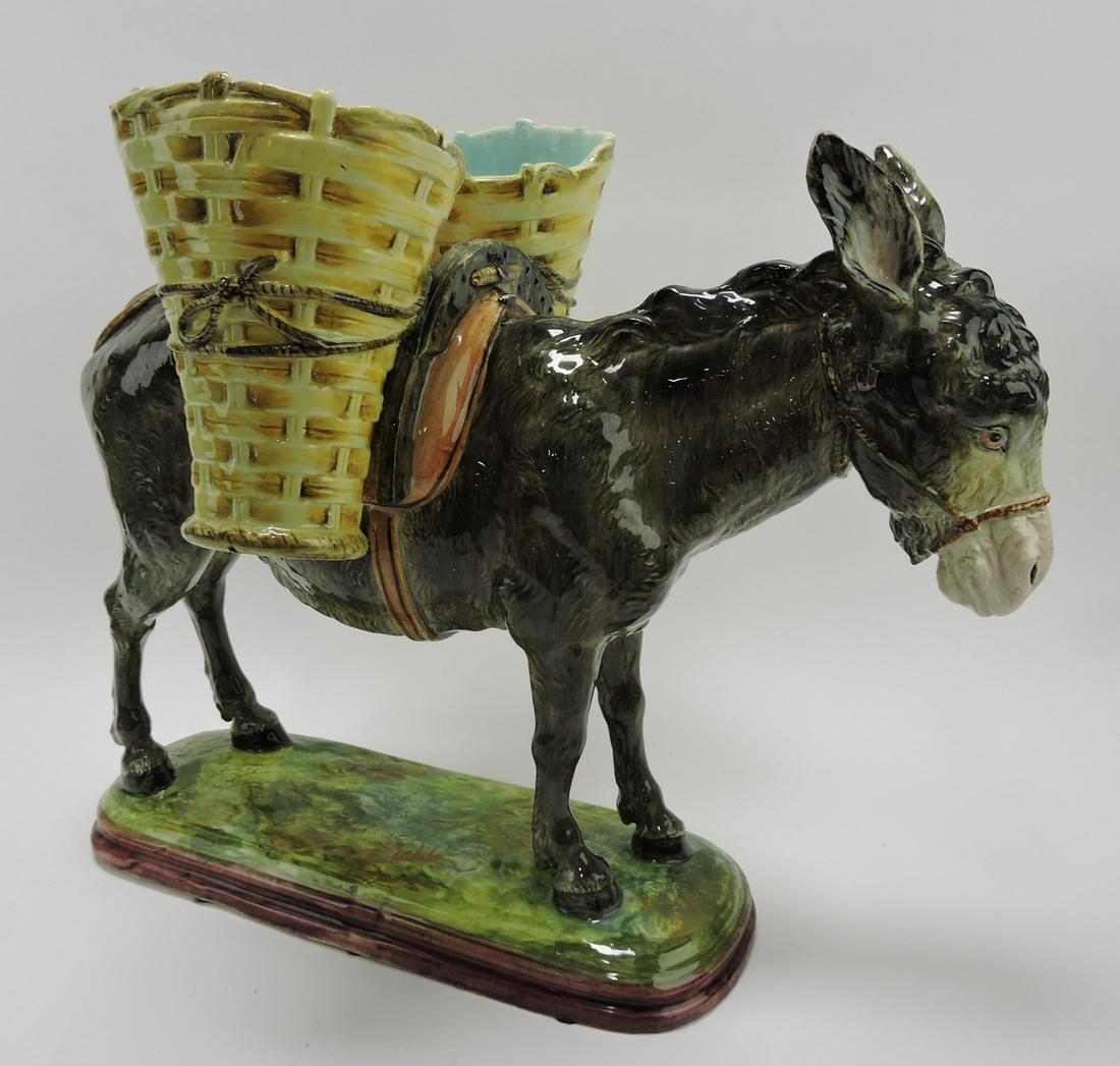 Jerome Massier monumental majolica: figural spill vase of donkey saddled with two large open baskets, 23"w, 18"h