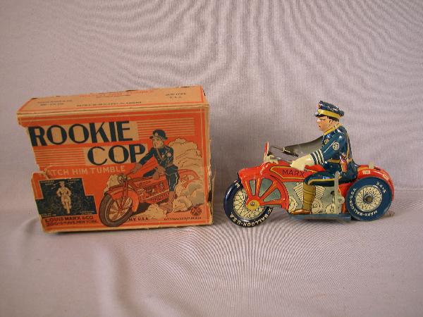 Louis Marx tin lithograph Rookie Cop tin windup mot: Louis Marx tin lithograph Rookie Cop tin windup motor cycle and rider with box, losses to box
