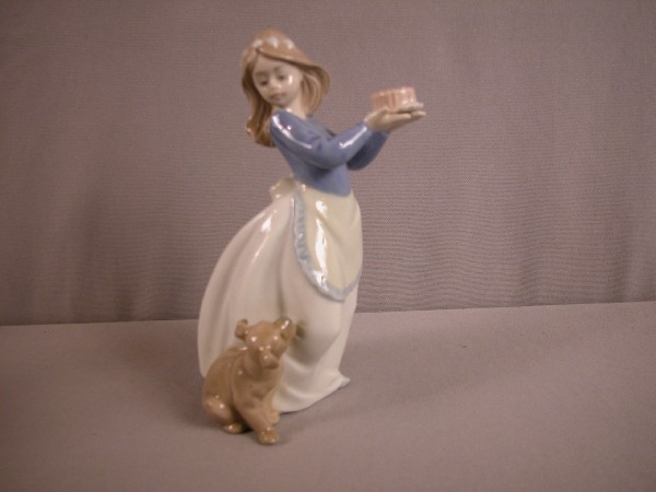 Lladro figure of lady holdingcake with dog, 7 1/2: Lladro figure of lady holdingcake with dog, 7 1/2"