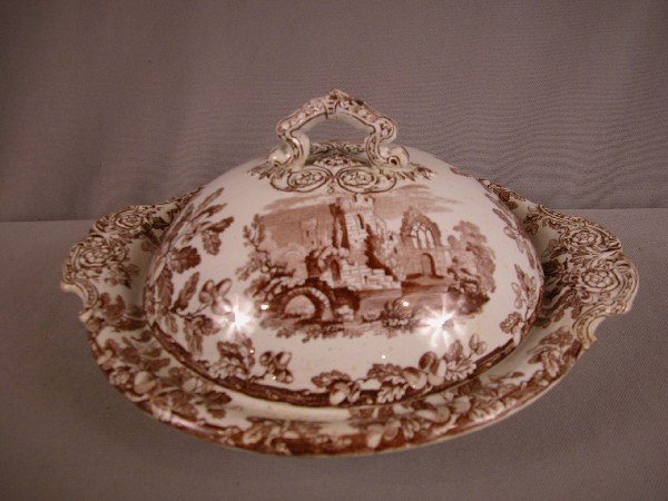 Copeland set of brown transfer ware ironstone, 54: Copeland set of brown transfer ware ironstone, 54 pieces with pancake server with cover, comport, 15" platter,plates, cups & saucers, and other pieces, some damage to plates, cups and saucers, oak lea