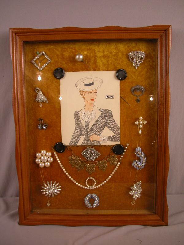 Frame of costume jewelry with Miriam Haskell and: Frame of costume jewelry with Miriam Haskell and other jewelry and print of Miriam Haskell