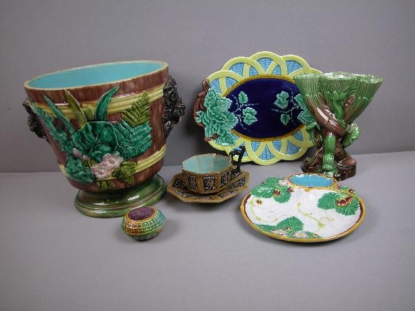 Majolica lot to include lion head handle jardinie: Majolica lot to include lion head handle jardiniere, dolphin vase, Brownfield cup and saucer, Minton strawberry plate, contemporary platter, and pin cushion, various condition