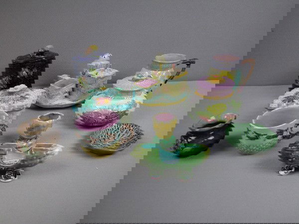 Majolica group to include - soap dish, mug, cup,: Majolica group to include - soap dish, mug, cup, sugar, covered jar, 4 pc. condiment set, egg cup, butter pat, Ruppert's balm jar, pickle toothpick holder, various condition