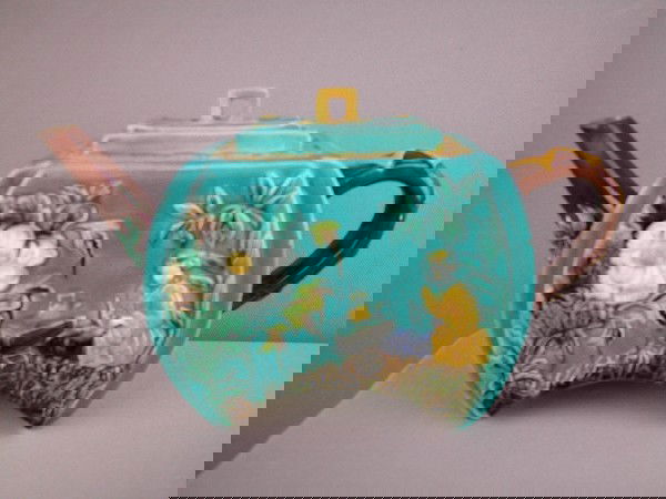 Majolica flat sided teapot with Oriental and flo: Majolica flat sided teapot with Oriental and floral motif , 10"l, handle repair, spout wear